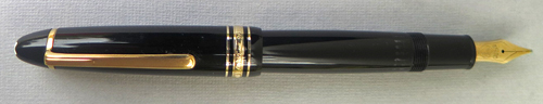 5887: MONTBLANC 146 WITH GOLD PLATED TRIM. NIB IS BROAD, 14K GOLD