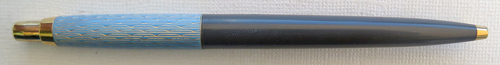 6023: PARKER PRINCESS JOTTER IN LIGHT BLUE WITH GOLD WAVE PATTERN ON CAP AND DARK GREY BARREL. METAL THREAD INCERT AND GOLD PLATED CLICKER WITH COVEX TOP. NO CLIP