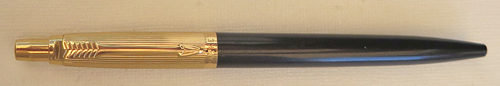 6366: EARLY PARKER JOTTER WITH GOLD PLATED CAP AND TRIM. BLACK BARREL WITH NO METAL INCERT ON TIP. CLICKER IS CONVEXT. METAL THREAD INCERT. Discovered in a shoebox in the home closet of a former Parker employee, Cliff Bickel.