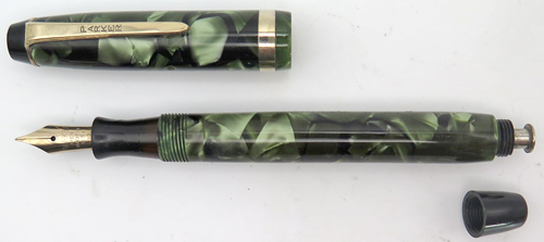 ITEM #1906: PARKER CHALLENGER FOUNTAIN PEN IN GREEN MARBLE. LENGTH OF PEN IS 4 3/4" WHEN CAPED. NIB IS 14 K IN FINE/MEDIUM. BOTTOM OF NIB SAYS "PARKER PEN MADE IN USA 27". 
