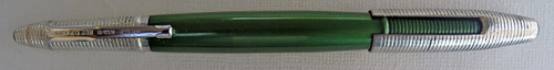 4592: REYNOLDS INTERNATIONAL BALLPOINT IN ANODIZED GREEN WITH GREEN JEWEL ON THE TIP OF THE CAP, IN NEAR MINT CONDIDITION, NEVER USED