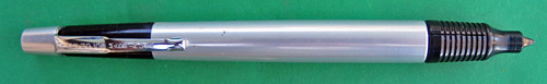 4594: REYNOLDS 400 BALLPOINT. BARREL IS POLISHED ALUMINUM, THE CAP AND POINT COVER ARE IN ANODIZED BLACK. THE FILLER TIP IS COVERED BY A SLIDING BALL PROTECTOR THAT CLICKS