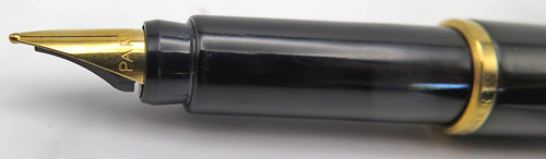 ITEM #4785: PARKER PLACE VENDOME or RIALTO 88 FOUNTAIN PEN IN GLOSSY BLACK LACQUER. GOLD CIRCLES ON BOTH TASSIE. GOLD PLATED TRIM. BROAD GOLD NIB. Comes with Parker piston converter filling system.