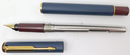 ITEM #4786: PARKER ARROW FOUNTAIN PEN IN MATTE BLUE LACQUER WITH MAROON TASSIES + SECTION. GOLD CIRCLES ON BOTH TASSIES. GOLD PLATED TRIM. GOLD NIB IS BROAD.