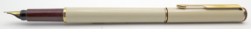 ITEM #4788: PARKER ARROW FOUNTAIN PEN IN CREAM. BLIND CAP & SECTION ARE MAROON. GOLD PLATED TRIM. "PARKER" GOLD NIB IN BROAD