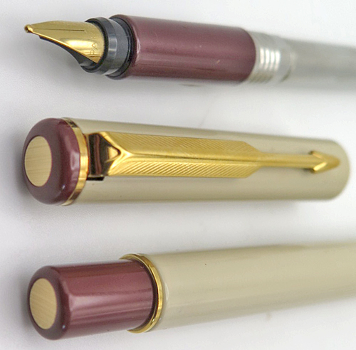 ITEM #4788: PARKER ARROW FOUNTAIN PEN IN CREAM. BLIND CAP & SECTION ARE MAROON. GOLD PLATED TRIM. "PARKER" GOLD NIB IN BROAD