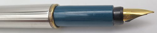 ITEM #4790: PARKER ARROW FOUNTAIN PEN IN CHROME. BLUE TASSIES & SECTION. GOLD PLATED TRIM. GOLD NIB IN FINE. Comes with Parker squeeze converter