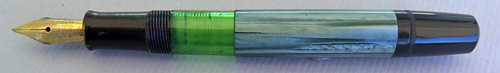 5408: PELIKAN 100 N WITH VERY FLEXIBLE MEDIUM NIB IN 14K GOLD. BLACK CAP WITH GREEN STRIPED BINDE WITH GOLD FILLED TRIM