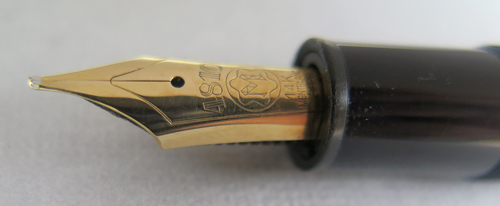 5887: MONTBLANC 146 WITH GOLD PLATED TRIM. NIB IS BROAD, 14K GOLD
