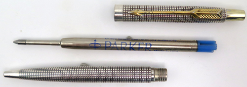 ITEM #6047: PARKER "CLASSIC" CLICKER BALL POINT IN STERLING SILVER CISELE PATTERN. GOLD PLATED TRIM. 