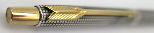 ITEM #6048: PARKER "CLASSIC" CLICKER BALL POINT IN STERLING SILVER CISELE PATTERN. GOLD PLATED TRIM.