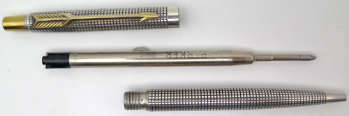 ITEM #6049: PARKER "CLASSIC" CLICKER BALL POINT IN STERLING SILVER CISELE PATTERN. GOLD PLATED TRIM. 