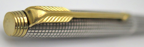 ITEM #6051: PARKER "CLASSIC" CLICKER BALL POINT IN STERLING SILVER CISELE PATTERN. GOLD PLATED TRIM.