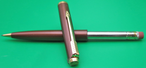 ITEM #6178: PARKER 45 PENCIL IN METALIC RUST. GOLD FILL TRIM. NOS. Mechanism works. Good eraser.