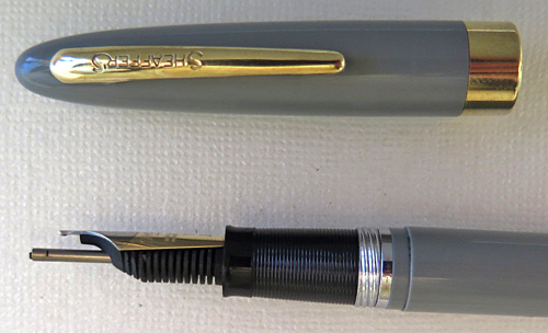 6194: SHEAFFER SARATOGA SNORKEL IN PASTEL GREY WITH OPEN TWO TONE GOLD NIB IN BROAD/MED