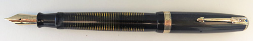 #6231: PARKER STD SIZE LAMINATED VACUMATIC WITH GOOD CLARITY IN BLACK WITH CLEAR LAMINATIONS & WIDE CHEVRON BAND. MEDIUM/FINE NIB