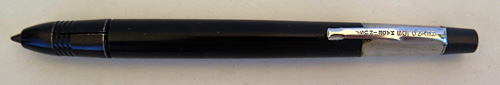 6237: REYNOLDS 400 BALLPOINT IN BLACK WITH ALUMINIUM TOP. FILLER TIP IS COVERED BY A SLIDING BALL PROTECTOR THAT CLICKS, WHICH IS AN INTEGERAL PART OF THE PEN. INCLUDES GUARANTEE CERTIFICATE AND ELABORATE DISPLAY CASE. DISPLAY CASE CONTAINS A CELLOPHANE COVER AND A CLEAR PLASTIC BASE. LIGHT BLUE VELVENTEEN BOX WITH REYNOLDS PEN LOGO STILL VISABLE