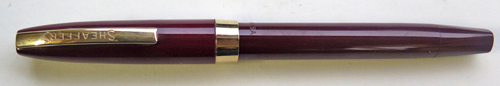 6305: SHEAFFER IMPERIAL TOUCHDOWN IN BURGUNDY WITH MEDIUM INLAID DOLPHIN NOSE 14K NIB. Gold filled trim. Clip has "SHEAFFER'S" written on it.