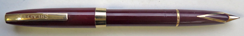 6305: SHEAFFER IMPERIAL TOUCHDOWN IN BURGUNDY WITH MEDIUM INLAID DOLPHIN NOSE 14K NIB. Gold filled trim. Clip has "SHEAFFER'S" written on it.