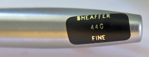 6310: SHEAFFER IMPERIAL TOUCHDOWN IN BLACK WITH BRUSHED STAINLESS. FINE STEELE NIB WITH DOLPHINE NOSE. ORIGINAL LABEL ON CAP SAYS "SHEAFFER 440 FINE"