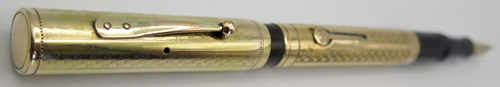 ITEM #6404: WATERMAN'S #0552 (GOLD FILLED OVERLAY) WITH FLEXIBLE MEDIUM #2 NIB. THE CAP HAS A MALL, FILLED HOLE IN IT RIGHT IN LINE WITH THE VENT HOLES. IT'S HARD TO SEE AND IT LOOKS LIKE SOMEONE STAMPED THE DIGIT "8" ON THE SIDE OF THE CAP. CHECK OUT THE PHOTOS. It has a small personalization on the side of the barrrel, "D. Fahler".