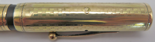 ITEM #6404: WATERMAN'S #0552 (GOLD FILLED OVERLAY) WITH FLEXIBLE MEDIUM #2 NIB. THE CAP HAS A MALL, FILLED HOLE IN IT RIGHT IN LINE WITH THE VENT HOLES. IT'S HARD TO SEE AND IT LOOKS LIKE SOMEONE STAMPED THE DIGIT "8" ON THE SIDE OF THE CAP. CHECK OUT THE PHOTOS. It has a small personalization on the side of the barrrel, "D. Fahler".