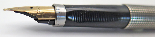 ITEM #6451: PARKER 75 STIRLING SILVER WITH FLUSH TASSIES. GOOD PATINA. HAS A "0" ON FRONT RING GRATICULES. NIB IS 14K IN BROAD.