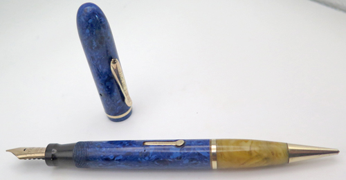 ITEM #6458: CONKLIN COMBO WITH BROAD NIB IN 14K. FOUNTAIN PEN BARREL IN MARBLE BLUE. COLOR MISMATCH ON THE PENCIL SECTION IN MARBLED ONYX/TAN. FULLY FUNCTIONAL.