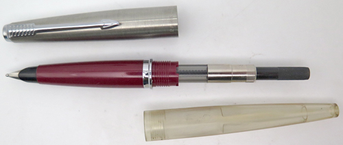 ITEM #6499: PARKER 45 DEMONSTRATOR WITH A BURGUNDY SHELL. STEEL 45 NIB IN BROAD. BRUSHED STAINLESS STEEL CAP WITH CHROME TRIM. 