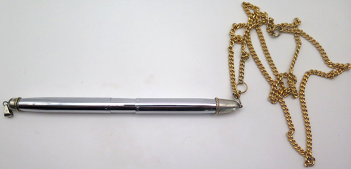 ITEM #6565: FISHER SPACE PEN WITH CHAIN-LIKE GOLD PLATED BANGLES. HARD TO FIND AS A NECKLACE. NECKLACE CHAIN IS GOLD PLATED. LONGER THAN MOST FISHER PENS. IN BOX WITH ORIGINAL REFIL & PAPERS. 