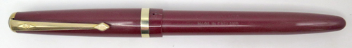 ITEM #6578: CONWAY STEWART FOUNTAIN PEN IN BURGUNDY, MODEL CONWAY 106. INCLOSED 14K NIB. GOLD FILLED TRIM. Sort crack in front of the band on the cap. 