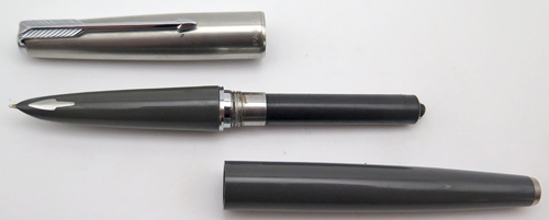 ITEM #6582: PARKER 61 FOUNTAIN PEN CAPILLARY FILLER IN GREY WITH CHROME TRIM. CAP IS BRUSHED STAINLESS. NIB IS 14K IN MEDIUM.