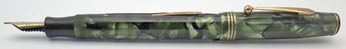 ITEM #6674: PARKER PARKETTE I FOUNTAIN PEN IN GREEN PEARLED MARBLE. LEVER FILLING UNIT. GOLD FILLED WITH TRIPLE BAND ON CAP. NIB IS MED 14K. BLACK TASSIES.