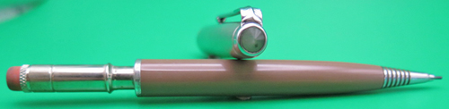 ITEM #6699: PARKER 51 PENCIL IN COCOA WITH LUSTRALOY CAP. This pencil is a cap actuated push type pencil that went with the Aerometric style fountain pen. No dents or dings in the metal. Standard size 51 Repeater pencil.