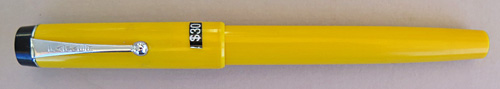 ITEM #6737: PARKER BIG RED IN MANDARIN YELLOW. HAS A BALL POINT BUT CAN BE EASILY CONVERTED TO A ROLLER BALL BY REMOVING THE EXTIONS ON THE FILLER.
