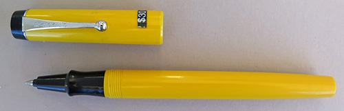 ITEM #6737: PARKER BIG RED IN MANDARIN YELLOW. HAS A BALL POINT BUT CAN BE EASILY CONVERTED TO A ROLLER BALL BY REMOVING THE EXTIONS ON THE FILLER.