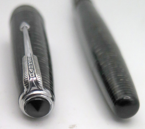 ITEM #6769: PARKER VACUMATIC STANDARD SIZE FOUNTAIN PEN IN BLACK/SILVER LAMINATED. NICKEL PLATED TRIM. DOUBLE BAND. PARKER ARROW NIB IN MEDIUM/FINE. 