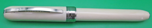 ITEM #6770: VISCONTI ROLLERBALL IN WHITE MARBLE REMBRANDT PATTERN/COLOR. PISTON FILLER. THIS IS A ROLLERBALL FRONT END WITH A PISTON FILLING MECHANISM (NOT A FRANKENPEN). IT WAS MADE THIS WAY BY VISCONTI. MAGNETIC LATCH ON THE CAP.