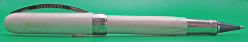 ITEM #6770: VISCONTI ROLLERBALL IN WHITE MARBLE REMBRANDT PATTERN/COLOR. PISTON FILLER. THIS IS A ROLLERBALL FRONT END WITH A PISTON FILLING MECHANISM (NOT A FRANKENPEN). IT WAS MADE THIS WAY BY VISCONTI. MAGNETIC LATCH ON THE CAP.