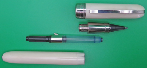ITEM #6770: VISCONTI ROLLERBALL IN WHITE MARBLE REMBRANDT PATTERN/COLOR. PISTON FILLER. THIS IS A ROLLERBALL FRONT END WITH A PISTON FILLING MECHANISM (NOT A FRANKENPEN). IT WAS MADE THIS WAY BY VISCONTI. MAGNETIC LATCH ON THE CAP.