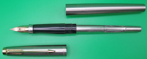 ITEM #6795: PARKER 75 FLIGHTER FOUNTAIN PEN. NIB IS 14K IN BROAD. CARTRIDGE FILLER WITH SQUEEZE TYPE CONVERTER. GOLD PLATED TRIM. 