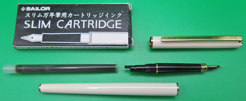 ITEM #6833: SAILOR ULTRA SLIM CHALANA FOUNTAIN PEN. IVORY LACQUER WITH BLACK SECTION + BURGUNDY JEWELS. "JAPAN" ON CAP JEWEL. , NEW OLD STOCK. IN BOX. MADE IN JAPAN