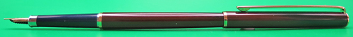 ITEM #6836: SAILOR ULTRA SLIM CHALANA FOUNTAIN PEN IN BROWN LACQUER STRIPE WITH NAVY SECTION. BLACK DOUBLE JEWEL. CAP JEWEL READS "JAPAN". 14K "SAILOR" NIB IN FINE. GOLD PLATED TRIM. NEW OLD STOCK IN BOX. Part #11-0520