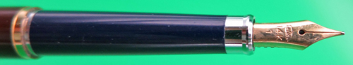 ITEM #6836: SAILOR ULTRA SLIM CHALANA FOUNTAIN PEN IN BROWN LACQUER STRIPE WITH NAVY SECTION. BLACK DOUBLE JEWEL. CAP JEWEL READS "JAPAN". 14K "SAILOR" NIB IN FINE. GOLD PLATED TRIM. NEW OLD STOCK IN BOX. Part #11-0520