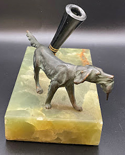 ITEM #6843: PARKER MARBLE PEN BASE WITH BRONZE FIGURINE OF DOG RETRIEVING DUCK. Black pen holder with two brass bands and brass socket. Dimension of base is 5 1/2 x 3 1/2 x 3 inches.