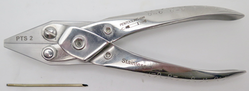 ITEM #PTS2: SIMPLE SNOKEL PLIERS. PARALLEL JAW SET OF PLIERS WITH A 1/16" GROVE. THE SLOT/GROVE RUNS FROM THE FRONT OF THE JAWS THROUGH THE BACK OF THE PLIERS. USED TO INSERT AND REMOVE SNORKEL TUBES WITHOUT DAMAGING THEM. 