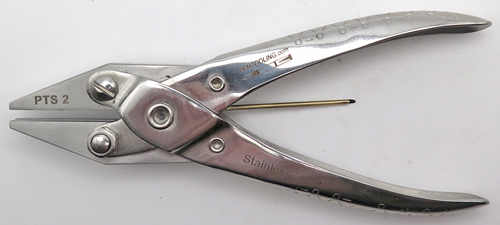 ITEM #PTS2: SIMPLE SNOKEL PLIERS. PARALLEL JAW SET OF PLIERS WITH A 1/16" GROVE. THE SLOT/GROVE RUNS FROM THE FRONT OF THE JAWS THROUGH THE BACK OF THE PLIERS. USED TO INSERT AND REMOVE SNORKEL TUBES WITHOUT DAMAGING THEM. 
